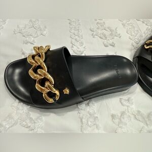 Versace slides. Worn once, they were always too small for me.